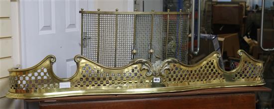 A Victorian pierced brass kerb, a set of 3 fire brasses and a bow fronted guard